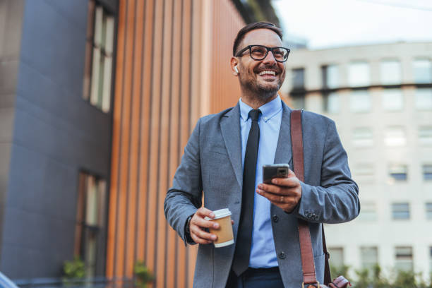 istock Confident Businessman Enjoying Coffee Break in Urban Setting 2187502499