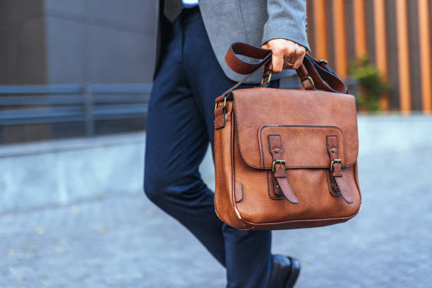 istock Professional Man Holding Brown Leather Briefcase in Urban Setting 2187502511
