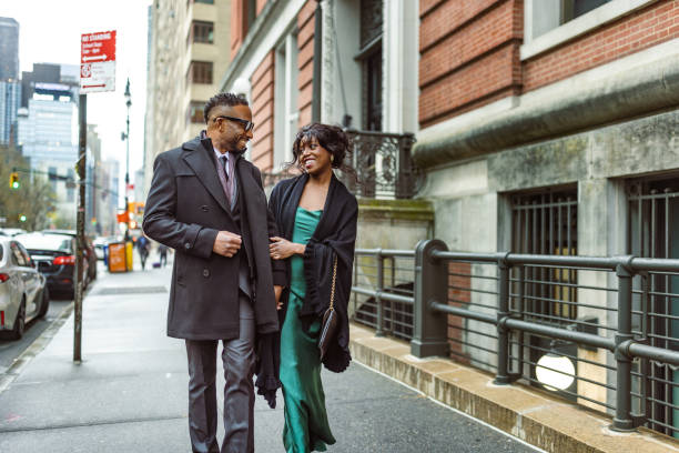 istock Elegantly Dressed Couple Strolling to Opera in Manhattan at Dusk 2187503758