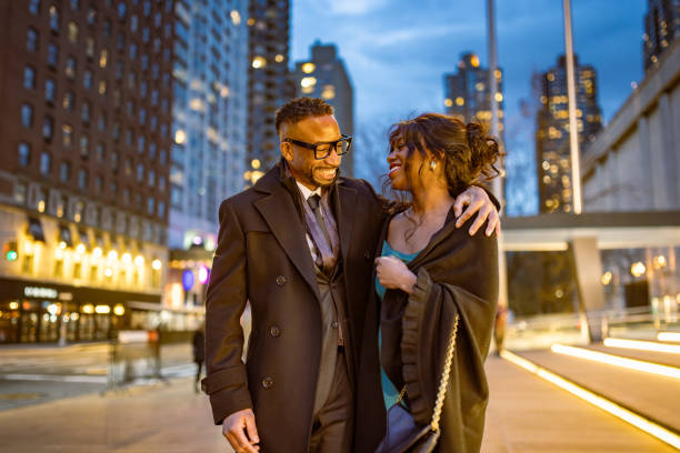 istock Elegantly Dressed Couple Walking in Manhattan at Dusk 2187503792