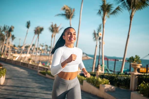 istock Active Hispanic Woman Jogging by the Sea 2187503798