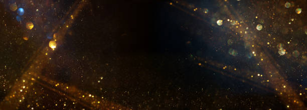 istock background of abstract glitter lights. gold and black. de focused 2187510642