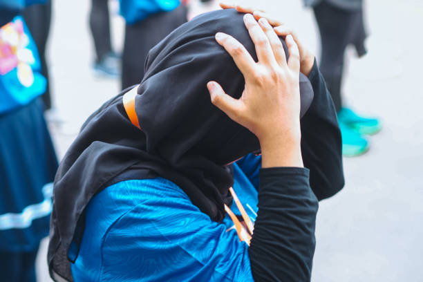 istock a dizzy Muslim holding his head 2187518052