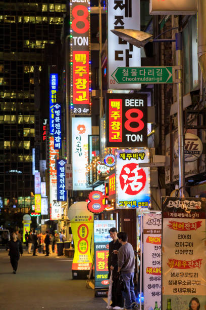 Seoul, South Korea - October 28, 2024: Illuminated street bar signs at night in the nightlife entertainment district of Jongno-Gu located in Seoul, South Korea.