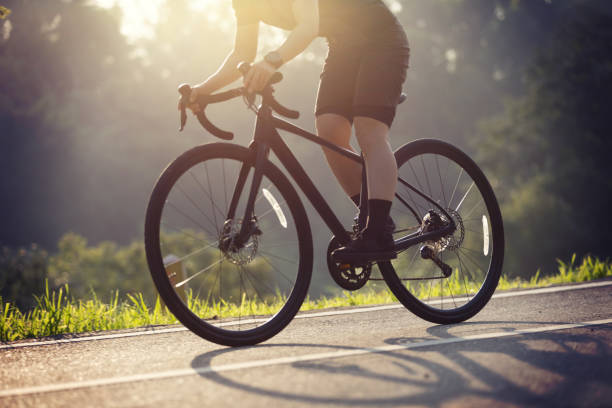 istock Woman cycling on summer park trail 2187523247