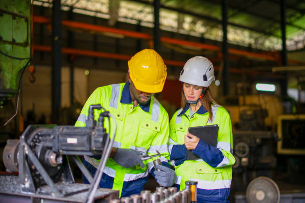 istock Blue collar workers are working at metal work factory. 2187531663