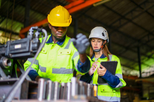 istock Blue collar workers are working at metal work factory. 2187531665