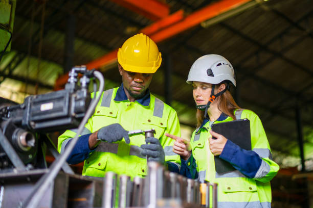istock Blue collar workers are working at metal work factory. 2187531674