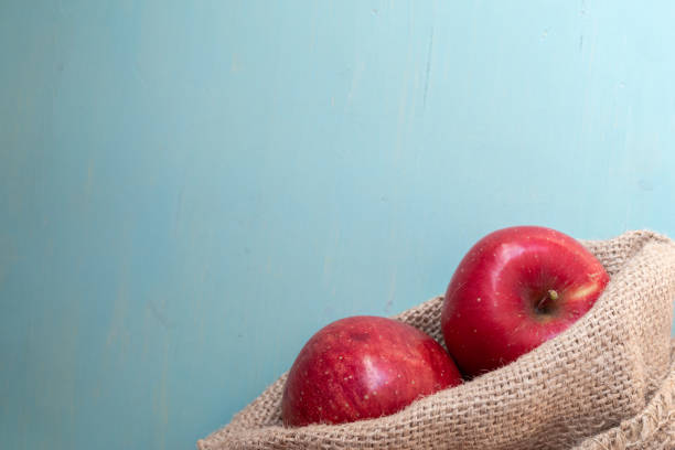 Delicious apples on a blue background