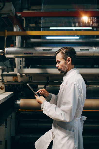 istock Engineer working at the factory with machinery and gadgets 2187534209