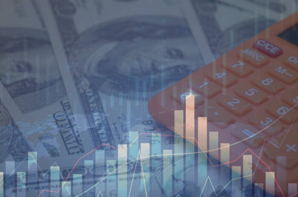 istock Financial Analysis: USD Money, Calculator, and Fluctuating Graph Depicting Market Changes 2187534478