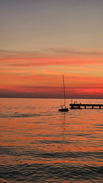 istock Sunset in Moda, İstanbul with a sailboat and a pier 01 2187535109
