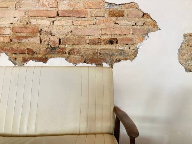 istock vintage leather with wood sofa and white wall reveal the old red bricks 2187537568