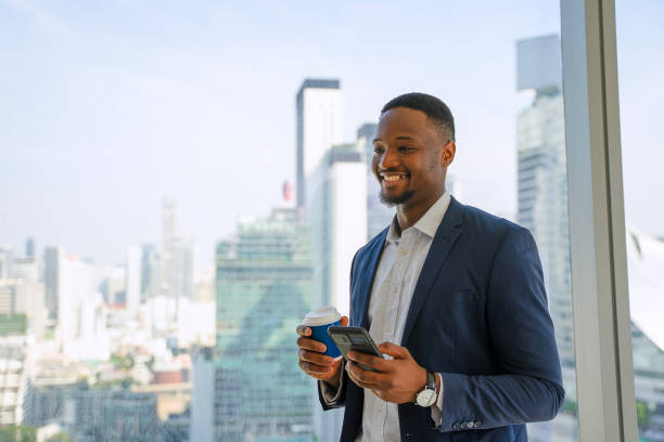 istock Business man is taking a break and play smart phone. 2187539784