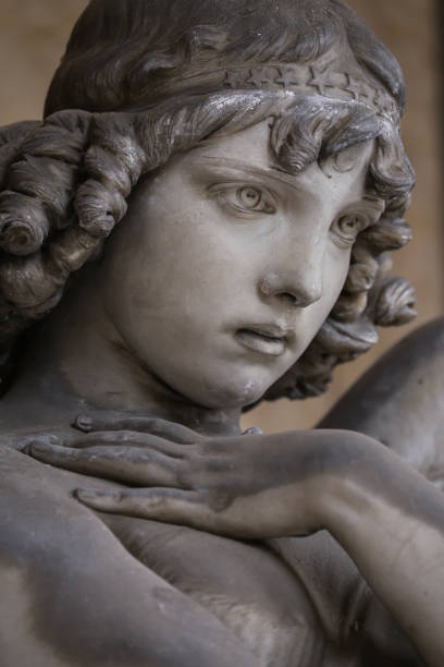 istock Guardian angel statue in antique cemetery. 2187539827