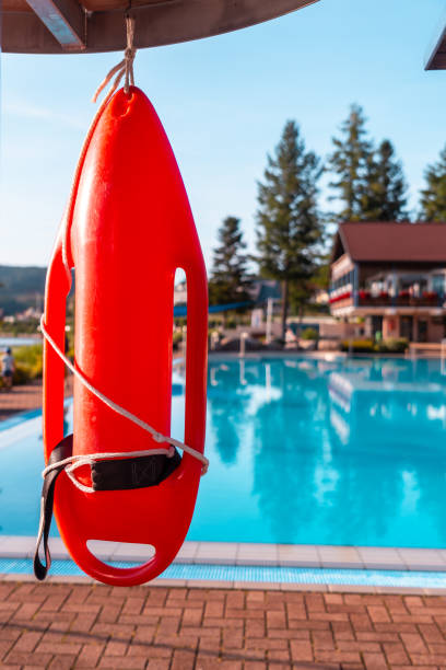 istock Red lifeguard float on a summer afternoon in an empty pool 2187542097