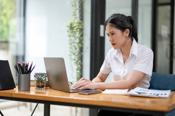 istock Stressed businesswoman working from laptop, project documentation error 2187542362