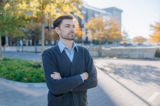 istock Thoughtful Professional Man Posing Confidently on a Bright Autumn Day 2187543734