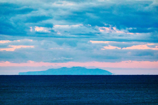 istock Scenic view of ocean agsint dramtic sky during sunrise 2187544674