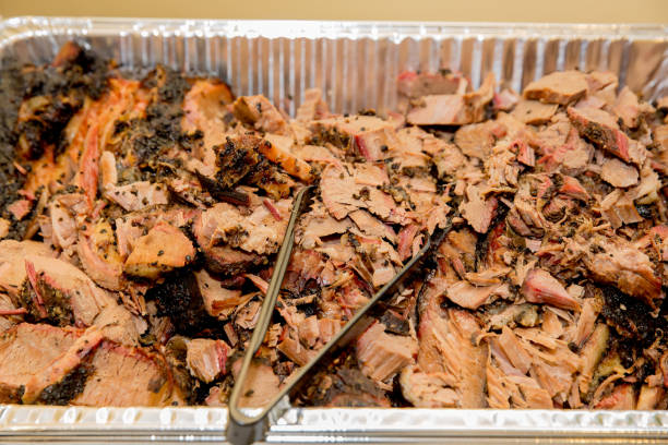 istock Pulled Pork with Tongs  Juicy Shredded Barbecue Meat Closeup 2187546254