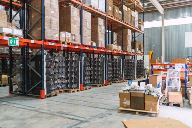 istock Logistics warehouse storing goods on shelves and pallets 2187549047