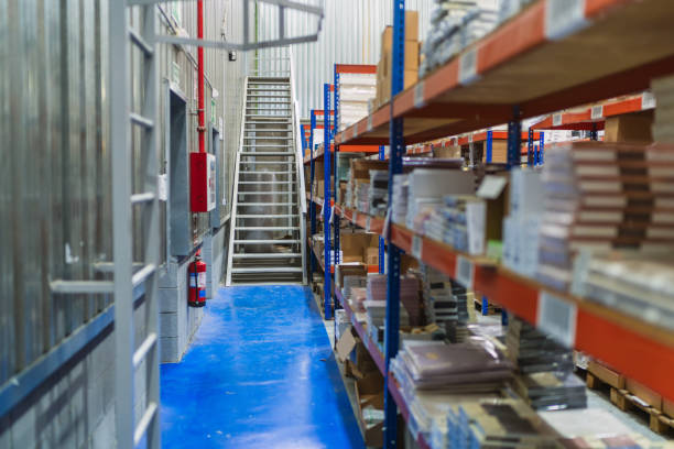 istock Logistics warehouse with metal staircase and organized shelves 2187549048