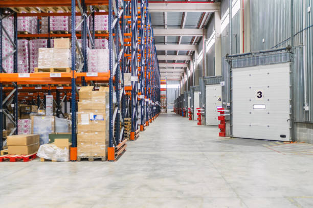 istock Logistics warehouse storing goods on metal shelves 2187549138