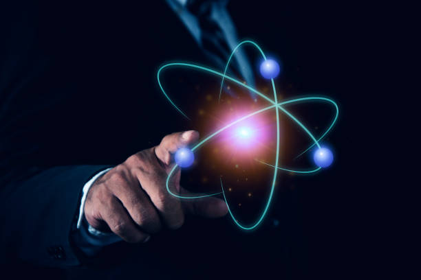 istock Bussinessman hand holding creative atom. Nuclear fusion concept, endless energy, cheap electricity, future technologies. Science and future concept 2187549462