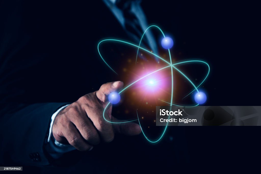 Bussinessman hand holding creative atom. Nuclear fusion concept, endless energy, cheap electricity, future technologies. Science and future concept - Zbiór zdjęć royalty-free (Abstrakcja) Bussinessman hand holding creative atom. Nuclear fusion concept, endless energy, cheap electricity, future technologies. Science and future concept - Zbiór zdjęć royalty-free (Abstrakcja)