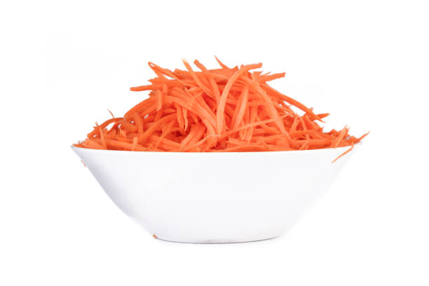 istock Carrots cut into thin strips as an ingredient for different dishes in a bowl on a white background. 2187552777