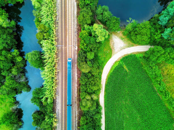 istock Train in a rural landscape of cultivated fields. 2187552926