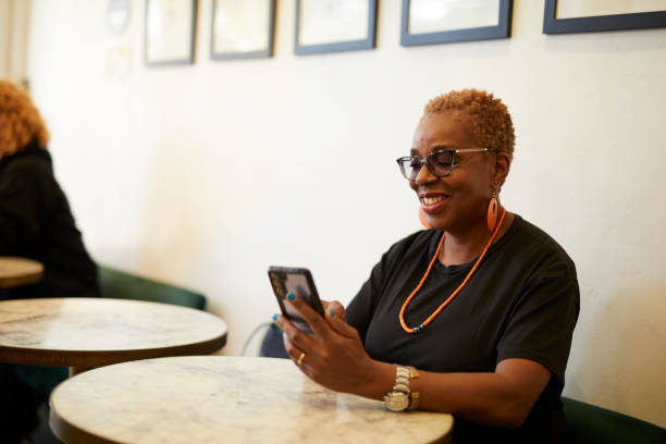 istock Middle aged black woman in a cafeteria 2187555863