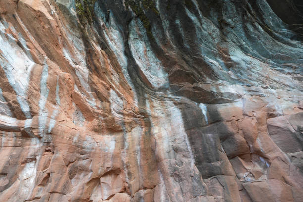 Brown stone rock texture background. Mountains surface. Close-up. Cracked broken crumbled.