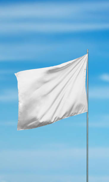 istock White blank flag against a clear sky, vertical composition, perfect for mockup designs, branding promotions, or showcasing customizable flags for creative projects 2187566519