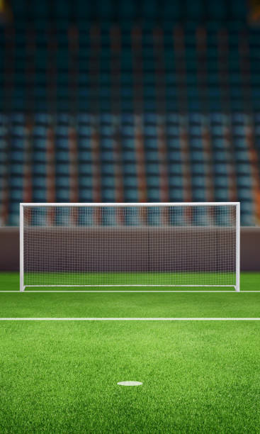 istock Empty football goal on a stadium field with stands in the background, vertical composition, ideal for sports promotions, event marketing, or creative designs 2187566535