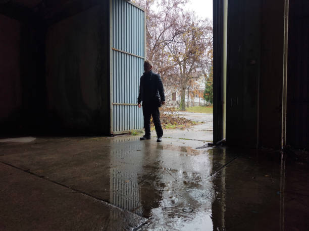 istock Spooky man at dark spooky abandoned building 2187568424