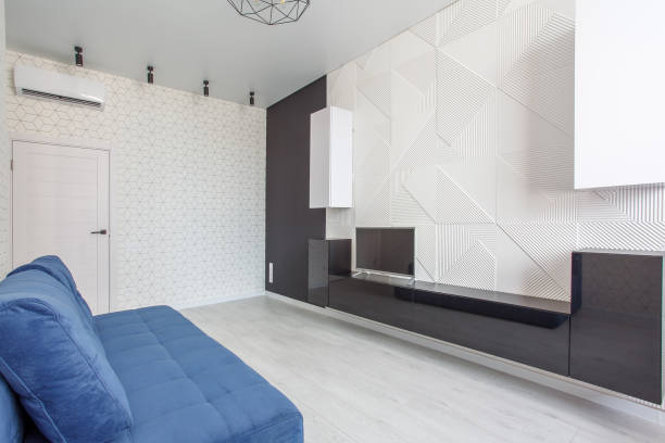 Living room with 3D Embossed Decorative Wall Panel with White and blue sofa.