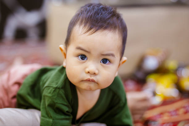 Adorable Baby Boy Looking at Camera. Cute Baby Boy with a Joyful Expression.