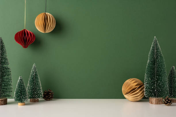 istock A side view serene Scandinavian-styled winter setup with minimalistic Christmas trees and hanging ornaments. Perfect for evoking festive elegance in a modern setting 2187575608