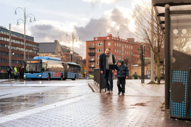istock Son pointing to father while walking in Scandinavian city 2187576433
