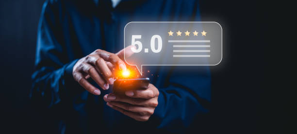 istock Customer services best excellent business rating experience. Satisfaction survey concept. Hand of a businessman chooses a smile face on wood block circle. 5 Star Satisfaction. 2187577852