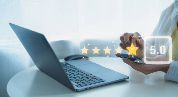 istock Customer services best excellent business rating experience. Satisfaction survey concept. Hand of a businessman chooses a smile face on wood block circle. 5 Star Satisfaction. 2187577862