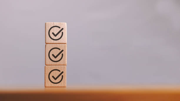 istock Stacked wooden cube block with check mark icon represent job checklist or task list in survey or assessment confirmation item in quality control, business goal and achievement concept. 2187579238