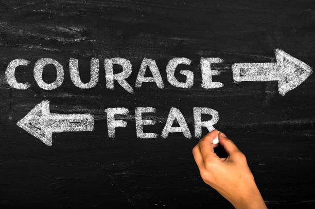istock Courage and fear arrows 2187579948