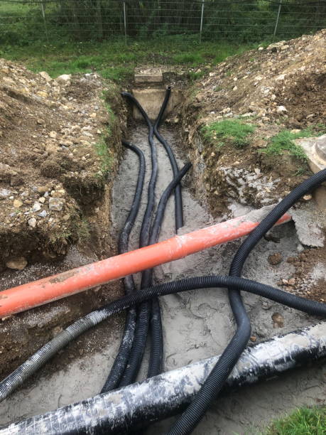 istock Cables and pipes are laid in a construction pit 2187583098
