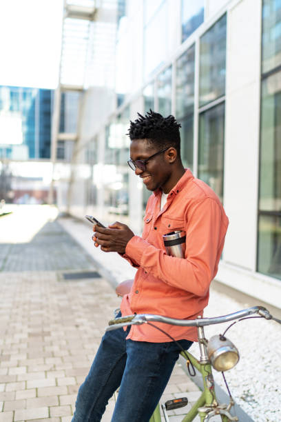 istock Smiling businessman using mobile phone in city 2187592029