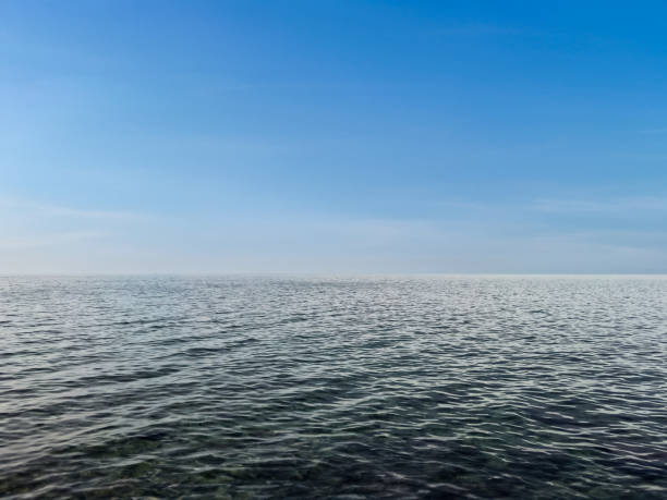 Calm sea under a clear sky. waterline. sea water surface. mockup. product display. minimalistic. abstract background