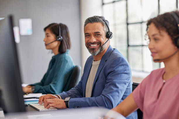 istock Portrait of professional call center agent looking at camera 2187593300