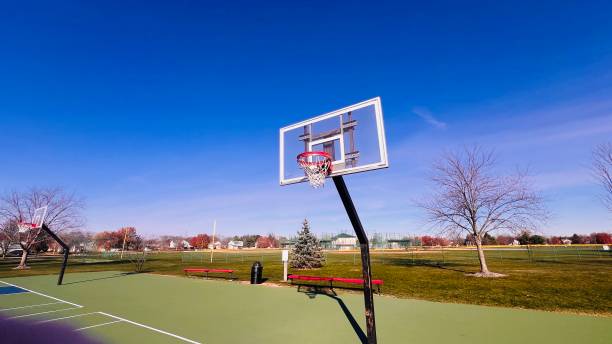 istock Basketball court on sunny day with blue sky. 2187593587
