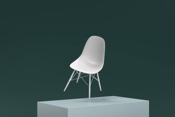 istock A white chair is sitting on top of a stack of blocks 2187595188